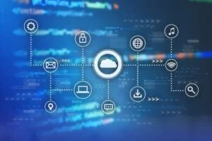 青い背景に、中央のクラウドアイコンから様々なサービスアイコンが点線で接続されている。これは、クラウドコンピューティングを介したデータやサービスの連携、ネットワーク接続、および現代のデジタル技術の概念を視覚的に表現している。