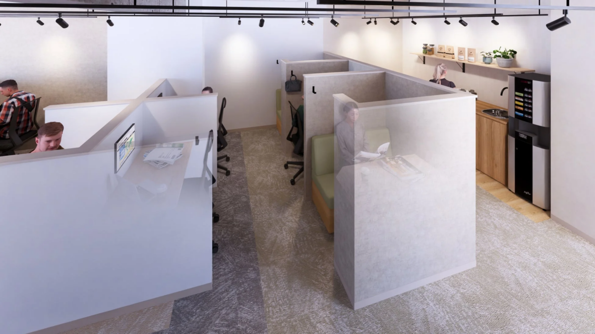 複数の個人用ワークブースが並ぶモダンなオフィスまたはコワーキングスペース